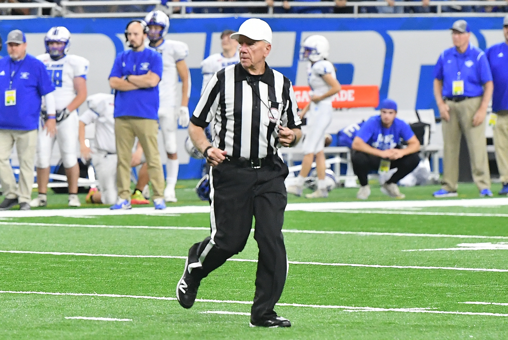 Chuck Walters officiates this past season's Division 5 Final.