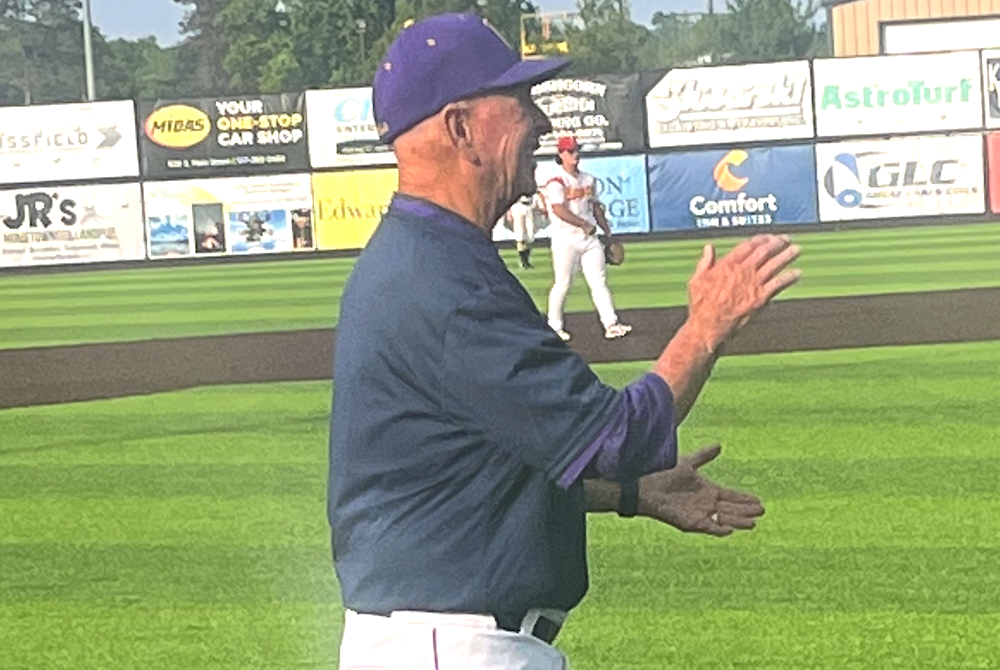 Retired Blissfield baseball coach Larry Tuttle coaches third base during the June. 26 Lenawee County All-Star Game.