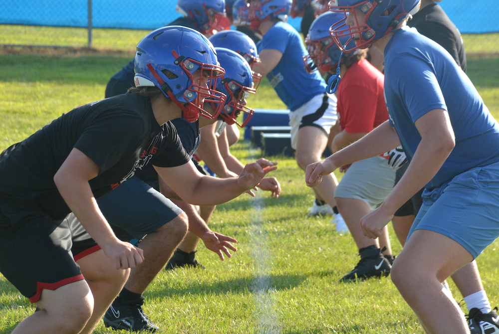 Linemen work on one-on-one drills during Mason’s first football practice Monday evening. 
