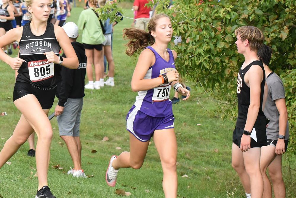 Blissfield’s June Miller (750) races during a cross country meet last fall. 