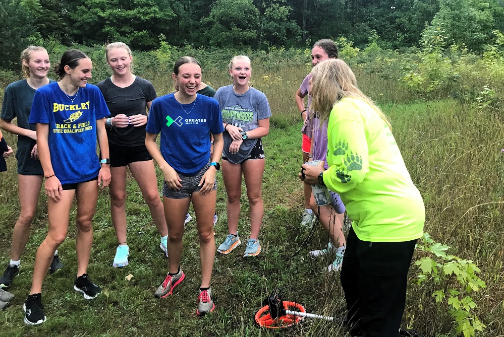 Buckley runners joke with coach Jolie King, far right, before a training run earlier this month.