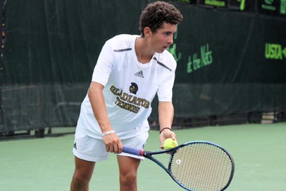 Traverse City St. Francis' Owen Jackson prepares to serve. 