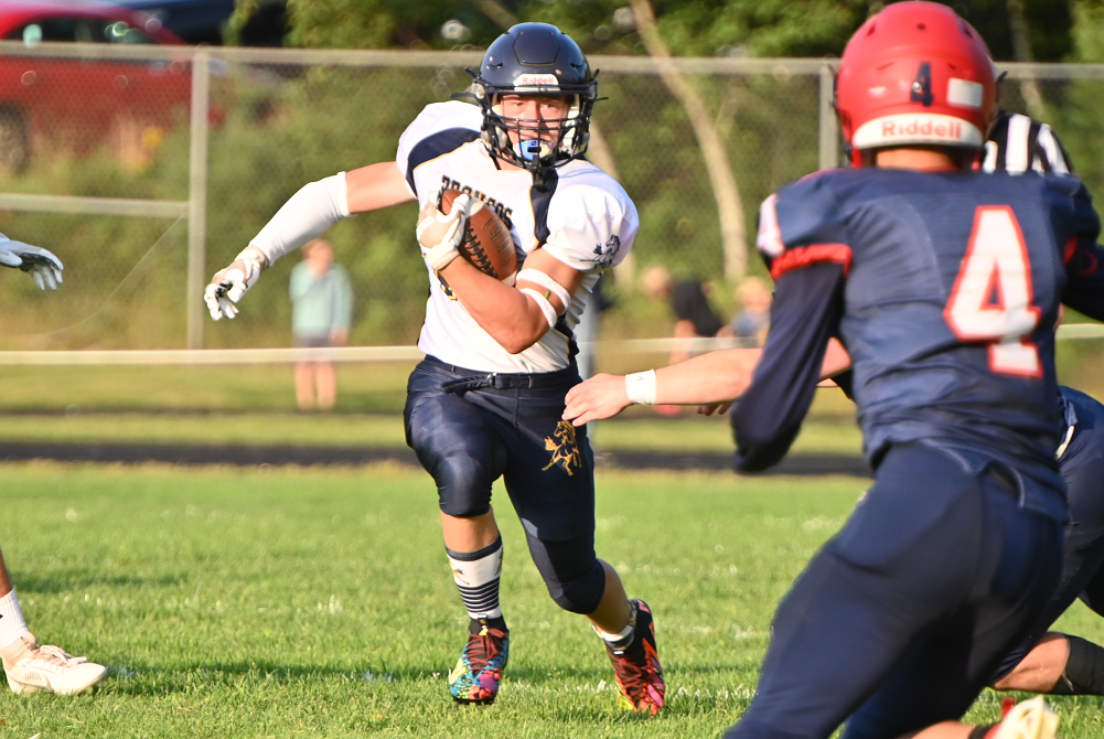 Bark River-Harris's Dominick Lantagne (13) finds a big hole and gains several yards during his team’s opening day win over Ishpeming Westwood.