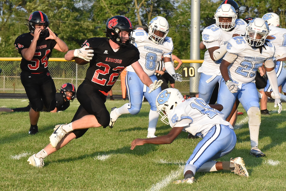 Addison’s Spencer Brown (22) attempts to elude a Detroit Voyageur defender during a 50-14 Week 1 win.