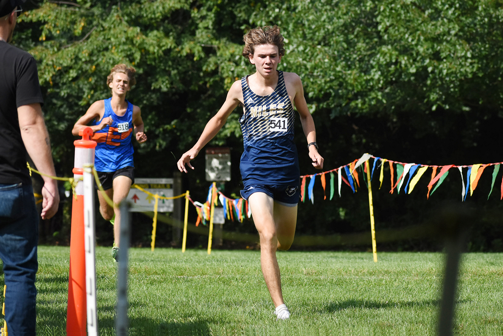 Niles’ Aiden Krueger crosses the finish line after winning his race during a home meet this season against Edwardsburg.