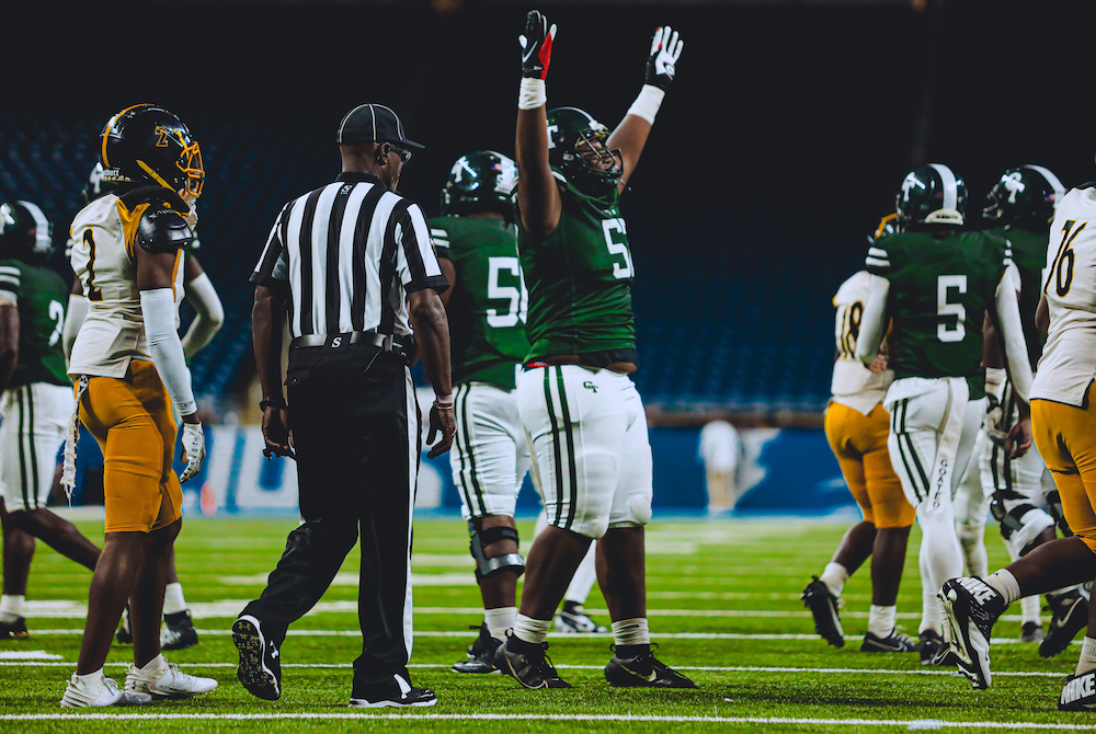 Detroit Cass Tech celebrates during its PSL Golf championship win at Ford Field.
