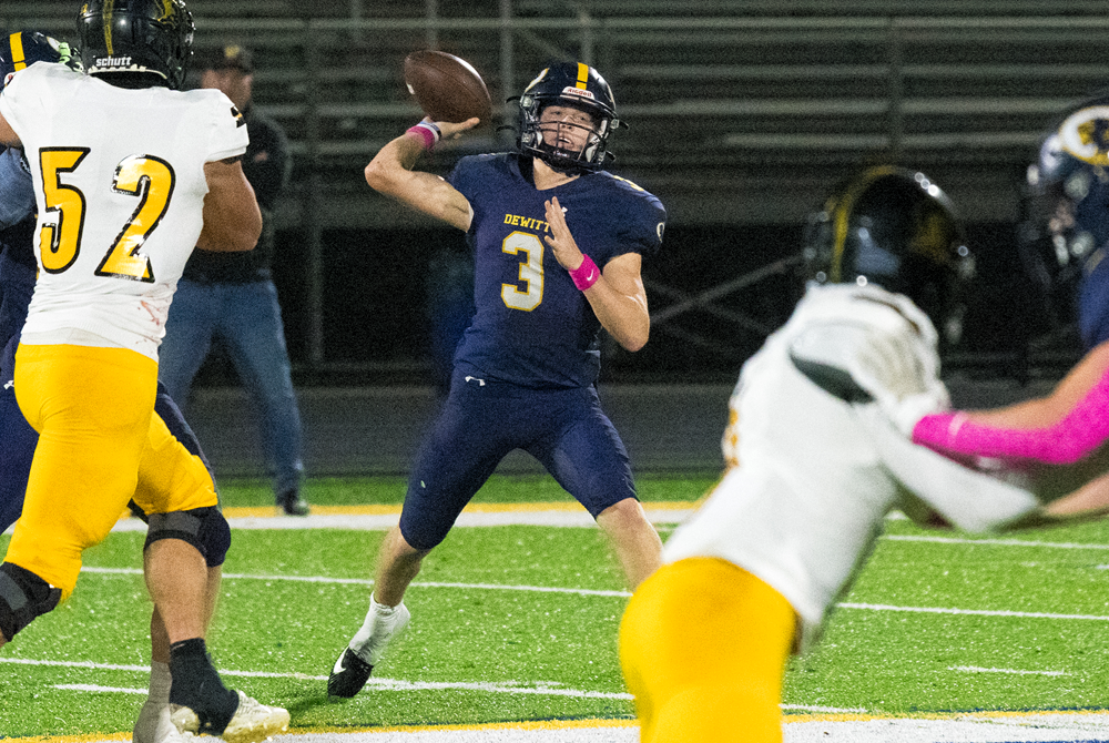 DeWitt's Elliott Larner (3) unloads a pass during a Week 9 win over Lansing Waverly.