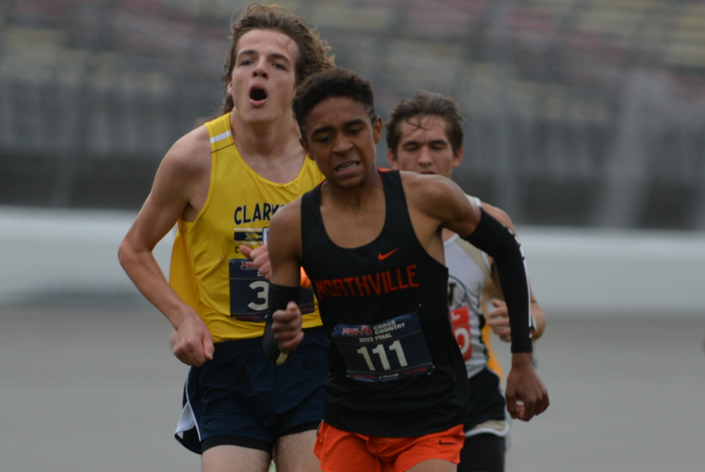 Northville’s Ethan Powell (111) leads a pack toward the finish of last season’s Lower Peninsula Division 1 Final at Michigan International Speedway. 