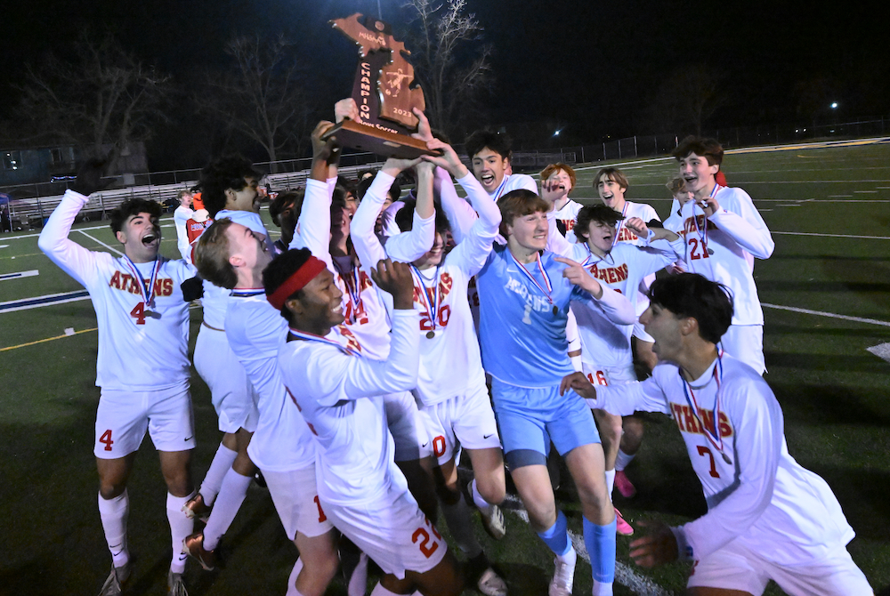Troy Athens celebrates its overtime win in Saturday's Division 1 Final at Grand Ledge.