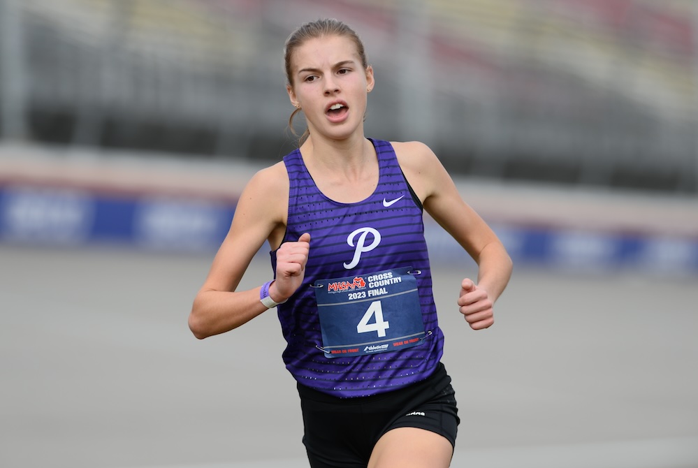 Ann Arbor Pioneer's Rachel Forsyth takes the final paces of her record-setting run Saturday at MIS. 