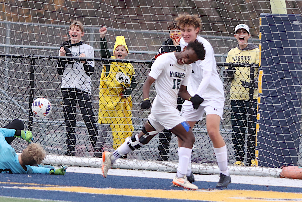 Muskegon Western Michigan Christian’s Tekalegn Vlasma (15) celebrates one of his two goals during Saturday’s Division 4 Final at Grand Ledge.