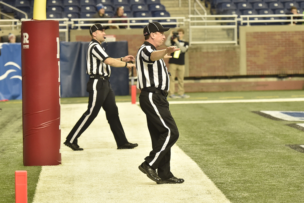 Officials signal a kick is no good.