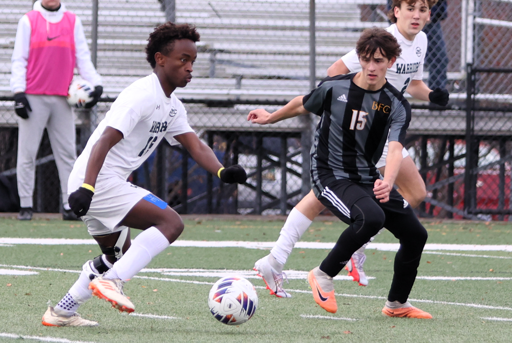 PHOTO Western Michigan Christian's Tekalegn Vlasma, left, makes his move during Saturday's Division 4 Final. 