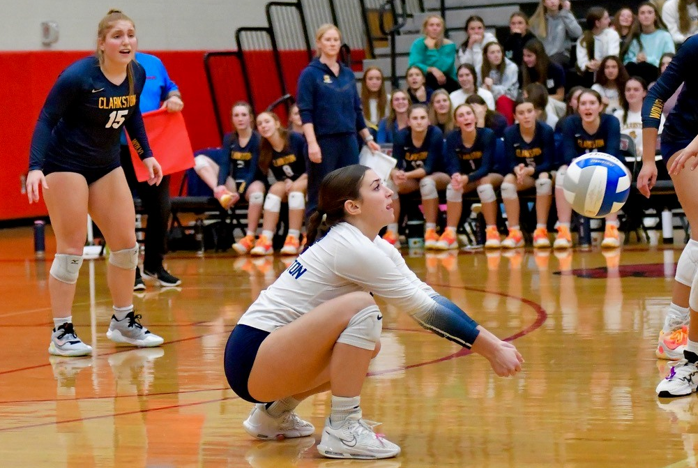 Clarkston libero Kiley Gallagher awaits an approaching hit during her team's Regional Semifinal win over Hartland last week.