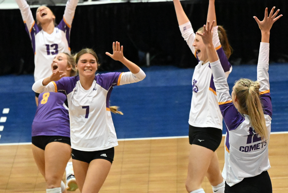 Comets including Lola Stecker (7) and Jovie Cochran (8) celebrate Thursday’s Division 3 Semifinal win at Kellogg Arena.