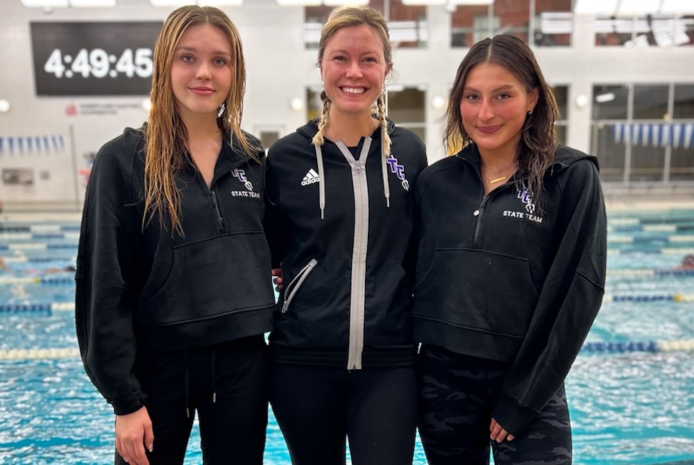 From left: Traverse City Tritons Ella Cabbage, coach Megan Petroelje and Kira Adams.