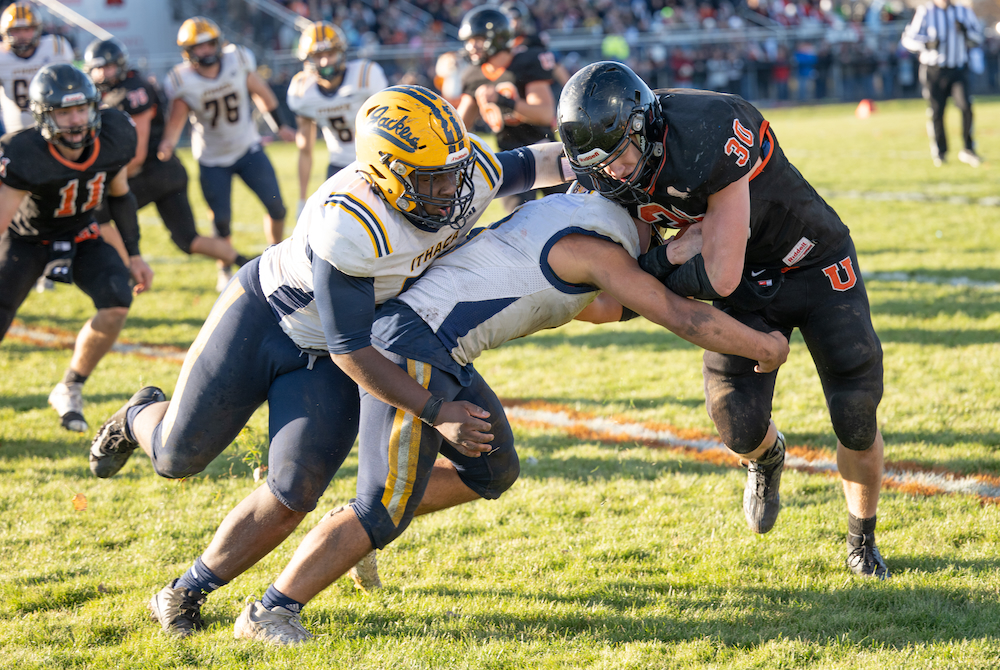 Ubly's Seth Maurer (30) takes on a pair of Ithaca defenders during last week's Regional Final win.