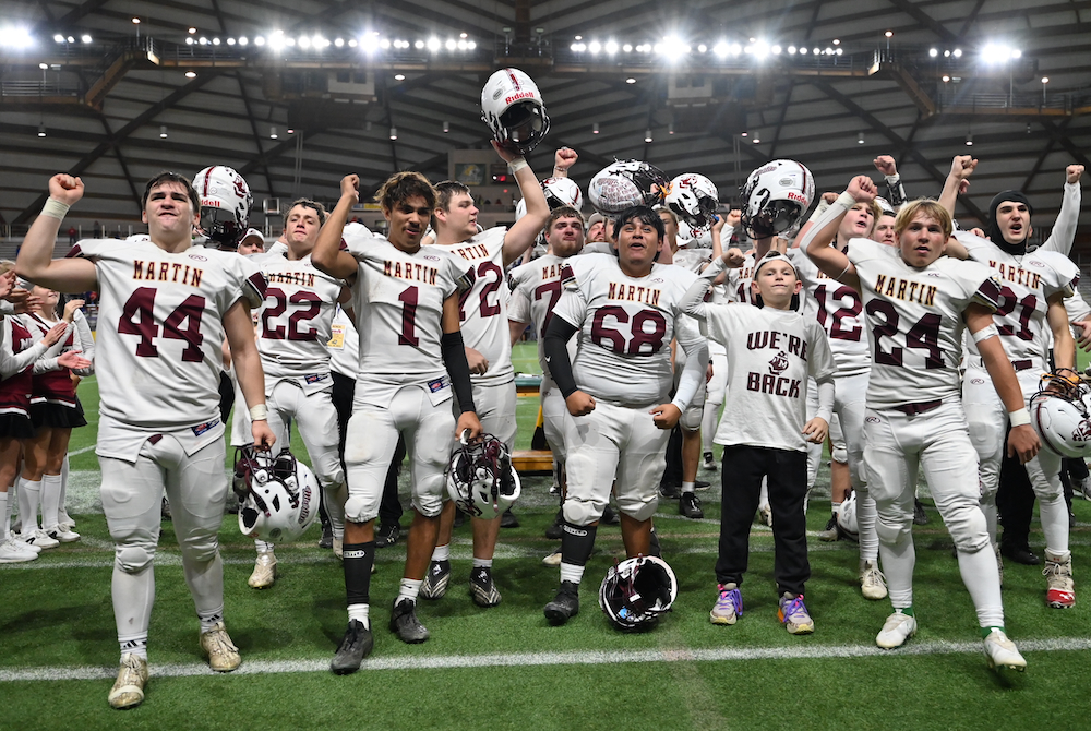 Martin players celebrate with their fans Saturday the program’s second-straight 8-Player Division 1 championship at Superior Dome.