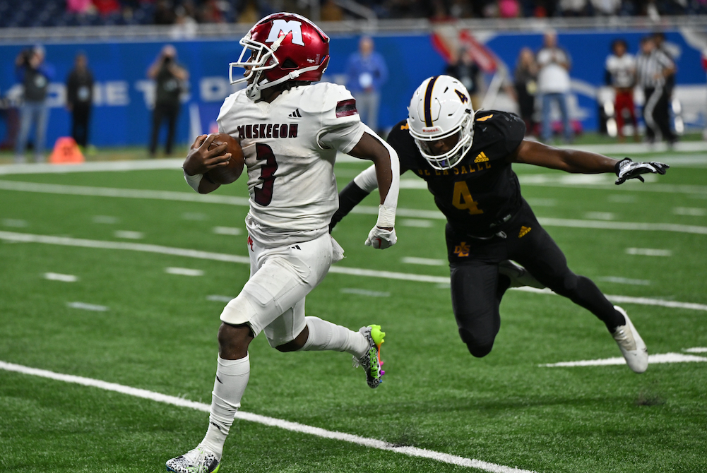 Muskegon’s M’Khi Guy (3) pulls away on one of his long runs during Saturday’s Division 2 Final at Ford Field.