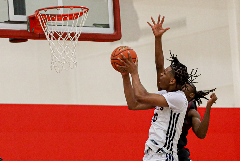 A Westland John Glenn player gets to the basket during U-D Jesuit's season-opening 83-48 win over the Rockets.