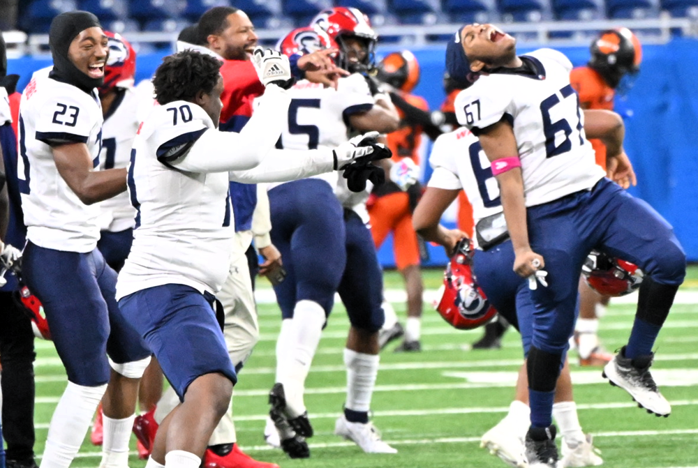 Southfield A&T players enjoy the first moments after their Division 1 championship win at Ford Field.