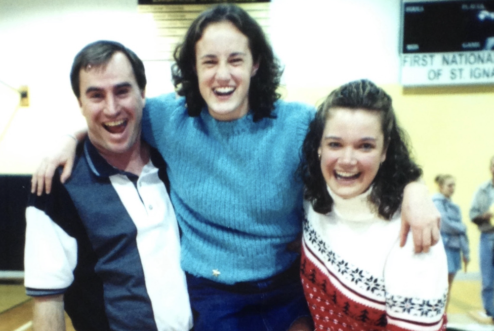 Doug and Dorene Ingalls, far left and right, respectively, take a photo with 2003 Miss Basketball Krista Clement.