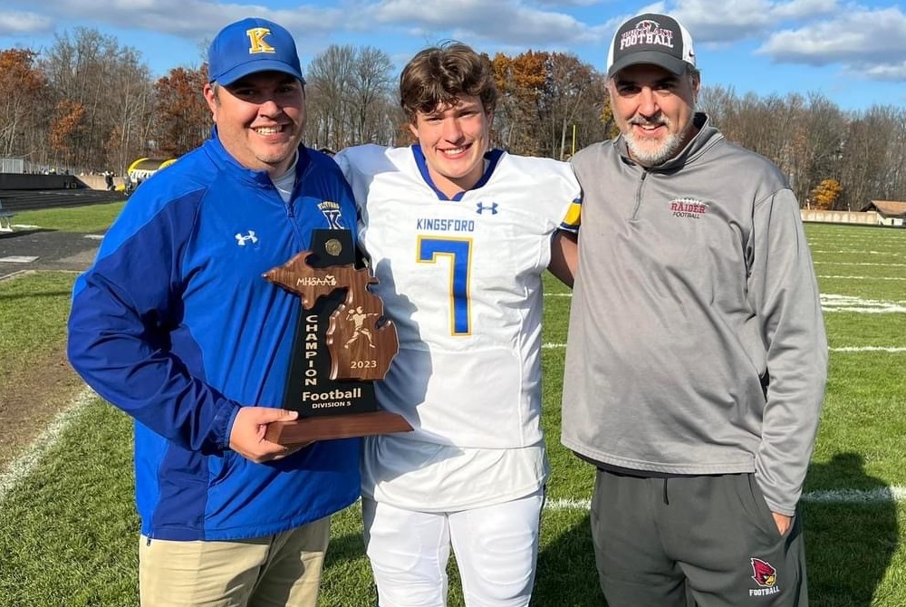 Kingsford football coach Mark Novara, far left, quarterback Nic Novara and Portland coach (and uncle) John Novara celebrate the Flivvers' District title.