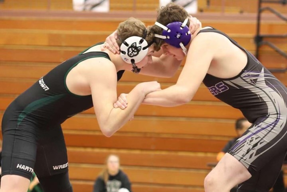 Lawrence senior Andrew Vazquez, right, wrestles against Hartford this season. 