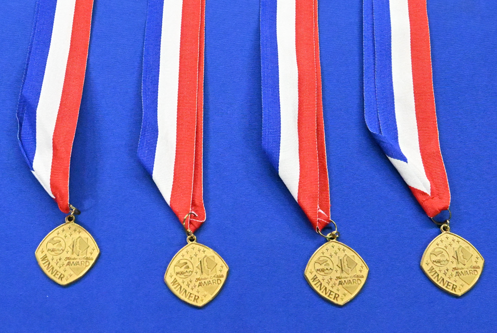 Scholar-Athlete medals are ready for presentation during the 2023 ceremony at Breslin Center.