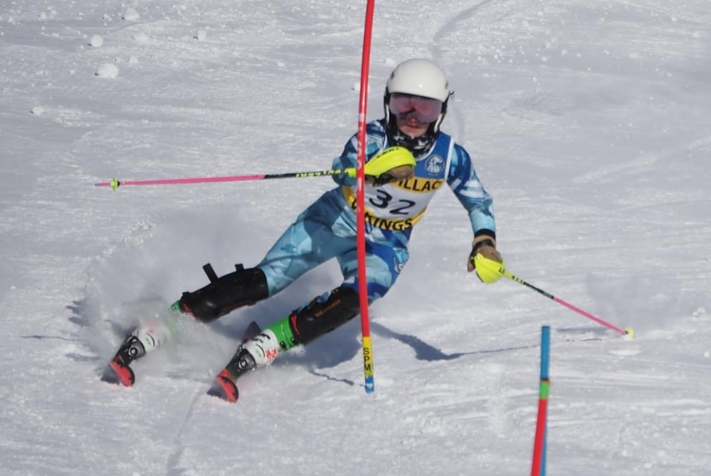 Cadillac's Onalee Wallis maneuvers past a gate during a race.