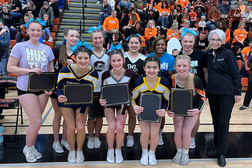 MHSAA official Jane Plaisted takes a photo with this year’s LMCCOA Division 1 scholarship winners. 