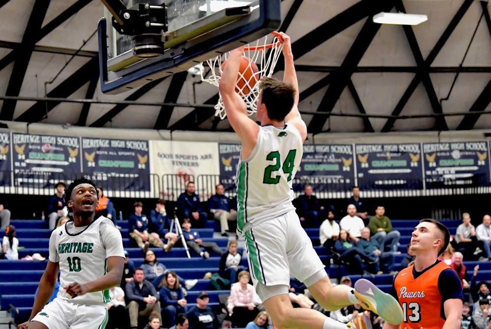 Saginaw Heritage’s Tyler Ode throws down a dunk during his team’s 80-40 win Thursday over Flint Powers Catholic.