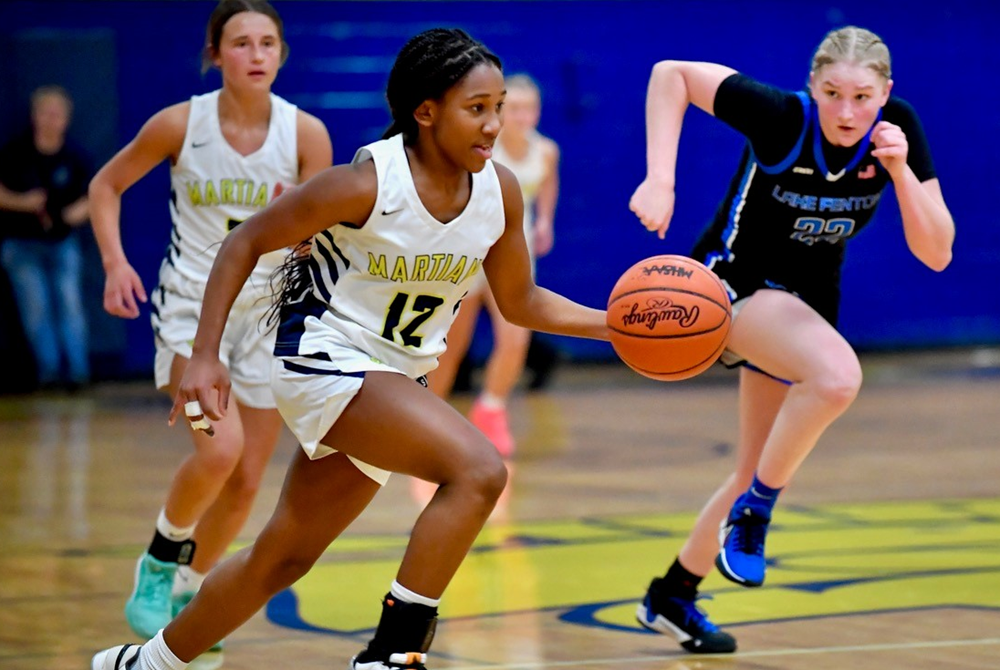 Goodrich's Kayla Hairston leads her team on a break during a 61-48 win over Lake Fenton on Feb. 16.