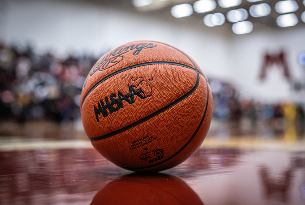 An MHSAA basketball sits on the court at Muskegon High School.