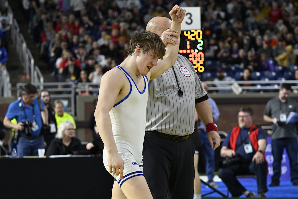 Kade Kluce’s arm is raised in victory after clinching his fourth Individual Finals championship Saturday.