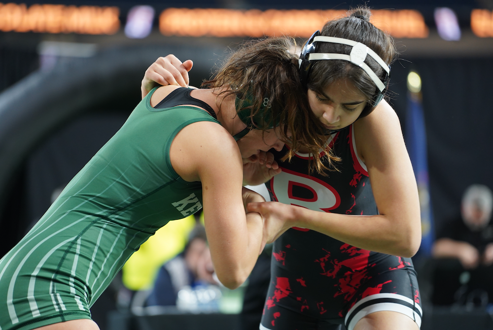 Romeo’s Belicia Manuel, right, takes on Waterford Kettering’s Emily Medford in Saturday’s championship match at 140 pounds.