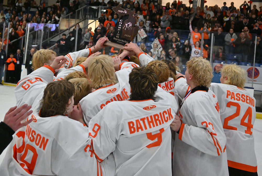 Byron Center raises its first Finals championship trophy Saturday after its Division 2 win over Trenton. 