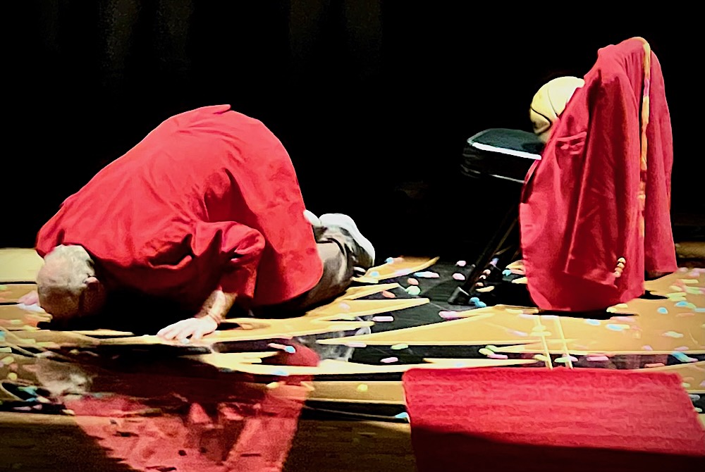 Beaverton boys basketball coach Roy Johnston kisses the court that bears his name during a celebration of his retirement Feb. 23.