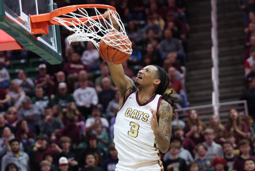 Jaremiah Palmer slam dunks during Niles Brandywine’s Division 3 championship win Saturday at Breslin Center. 