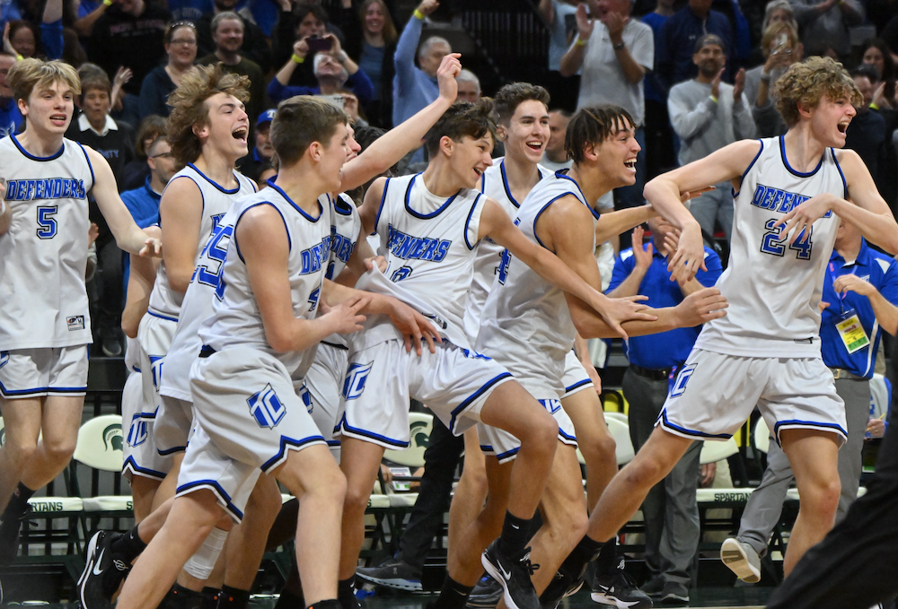 Wyoming Tri-unity Christian players begin to celebrate clinching the Division 4 championship Saturday at Breslin Center. 