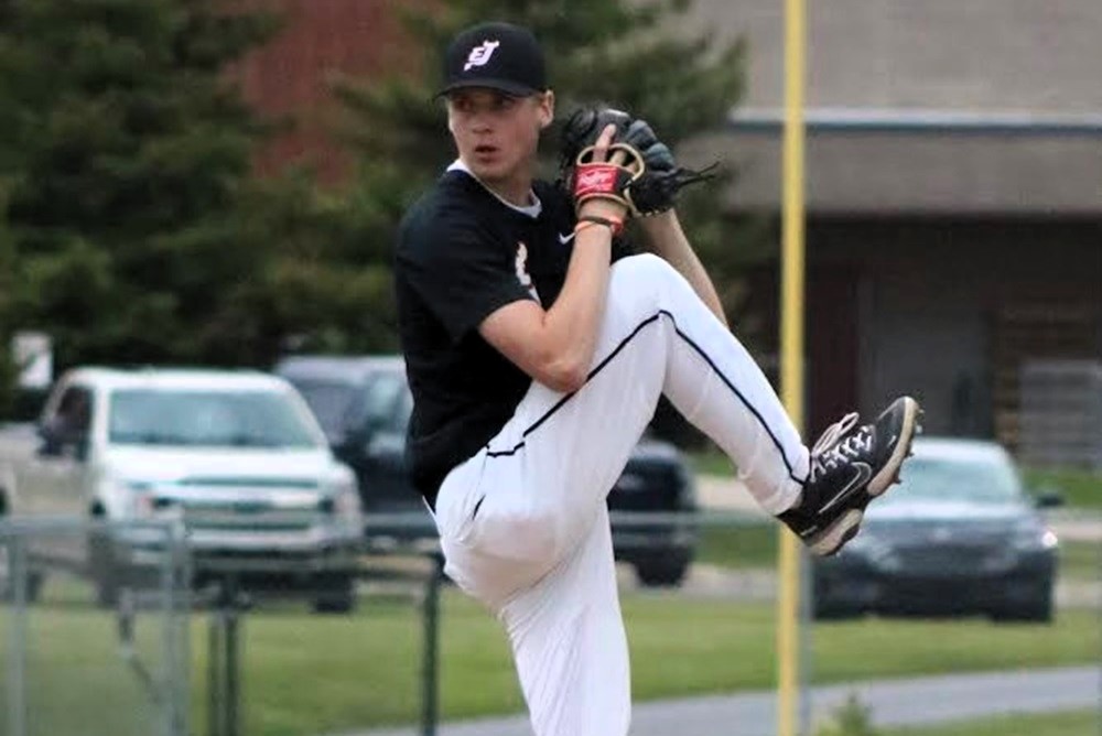 East Jordan’s Lucas Stone winds up during a game.