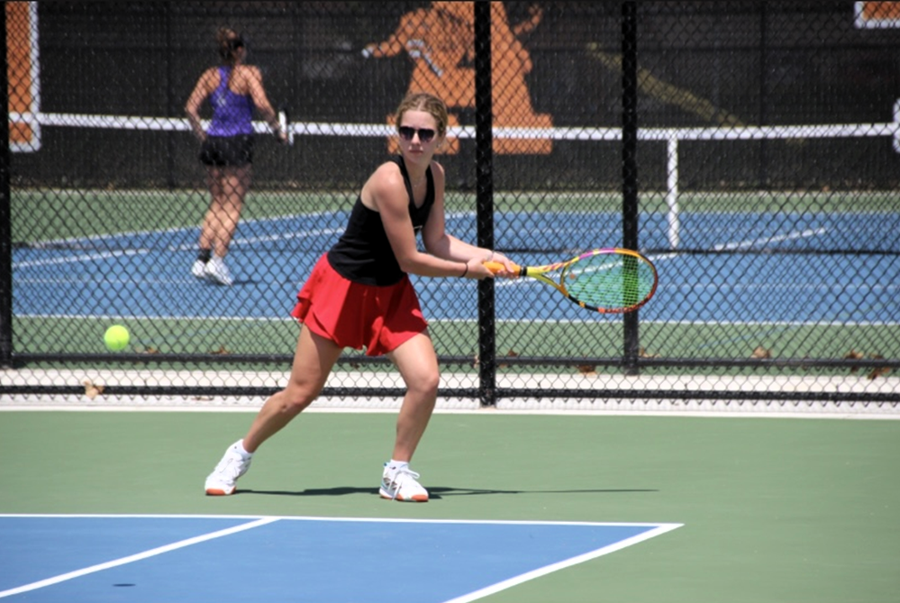 St. Johns' Isabel Thelen prepares to volley with a backhand during a match.