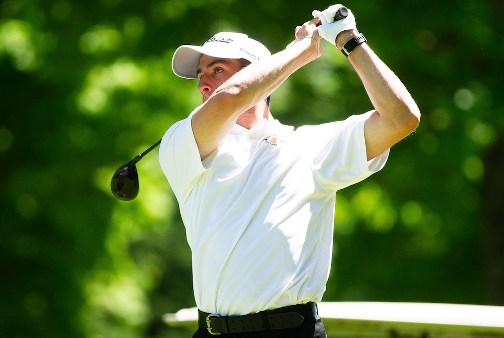 Iron Mountain's Cooper Pigeon drives on No. 14 at Young’s Golf Course on Wednesday.