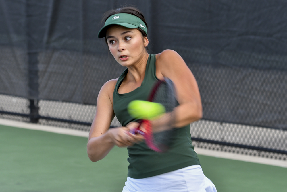 Forest Hills Central’s Lily Ohlman returns a volley during her No. 1 singles championship match Saturday. 
