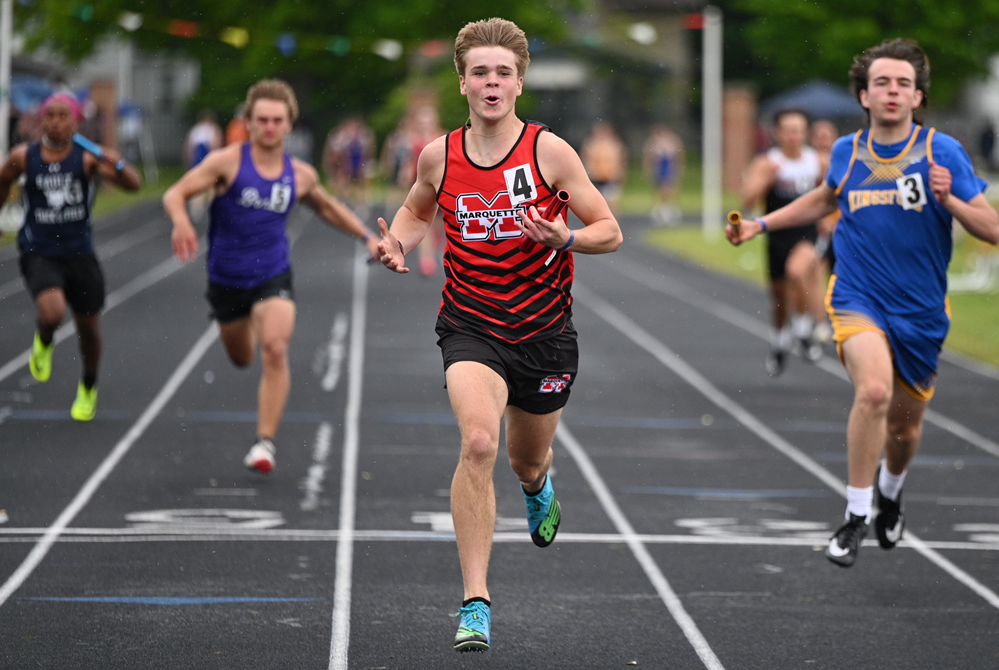 After crossing the finish line Saturday, Marquette's Kyler Sager celebrates winning the 400 relay. 