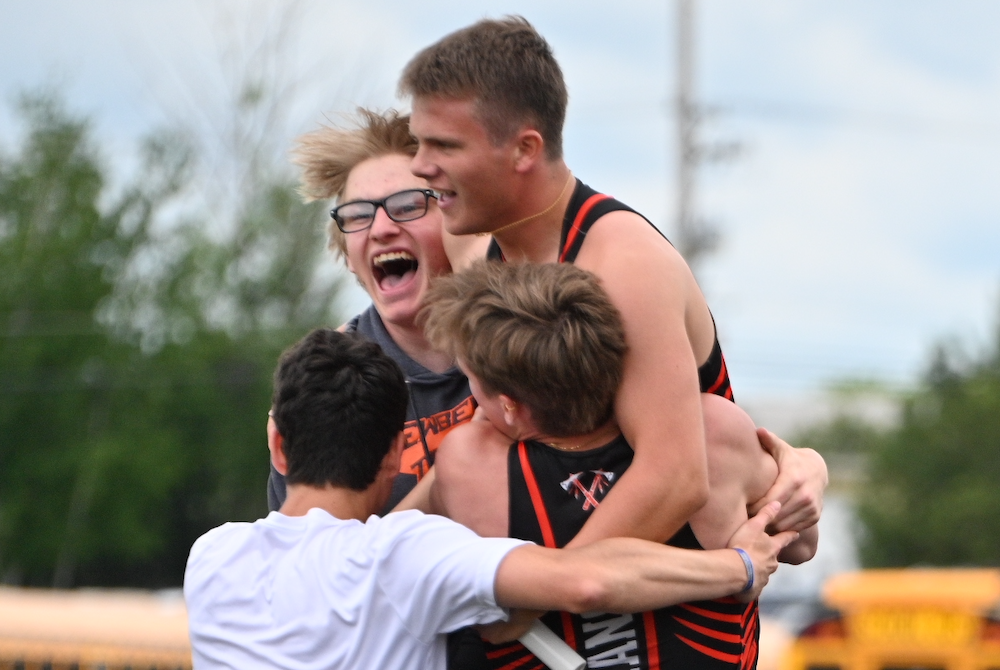 Newberry runners celebrate taking second place in the 1,600 relay, allowing them to finish ahead of St. Ignace for the team title in Upper Peninsula Division 3.