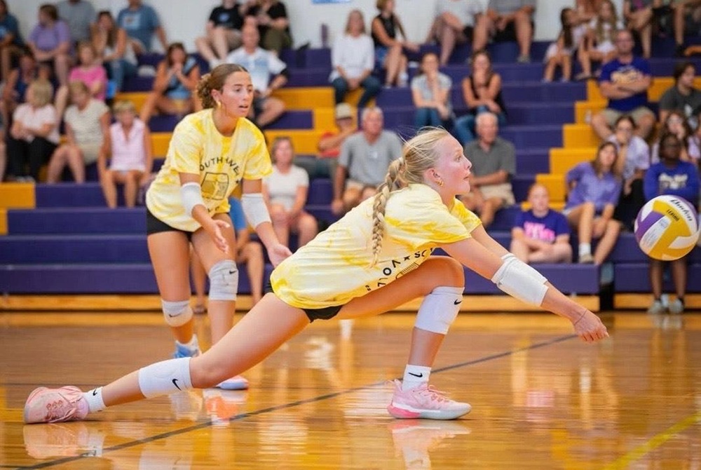 Senior Charlotte Knox reaches out toward a ball during South Haven’s alumni match earlier this month.