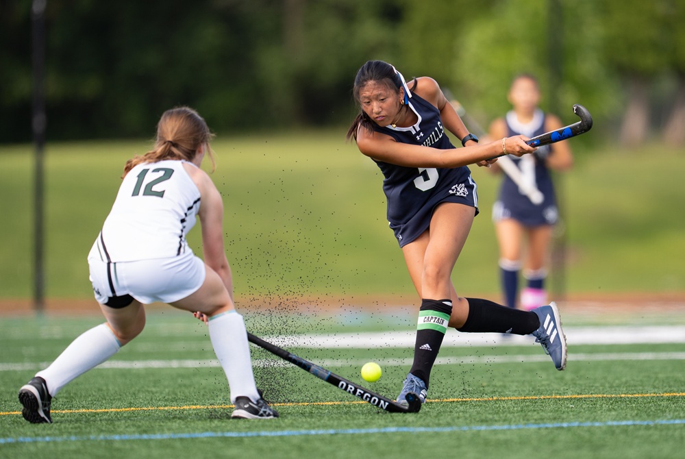 An Ann Arbor Greenhills field hockey player connects with the ball.
