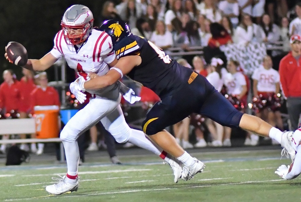 A Goodrich defender chases down Frankenmuth's quarterback during the Martians' Week 1 win.