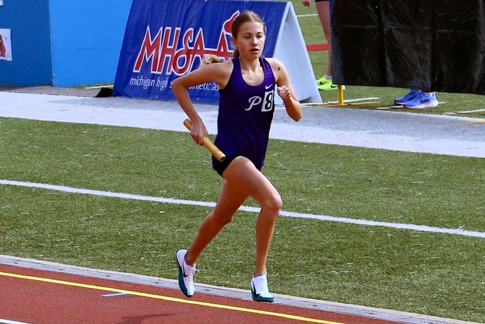 Pioneer's Natasza Dudek runs in the 3,200 relay during the springs LPD1 Track & Field Finals.